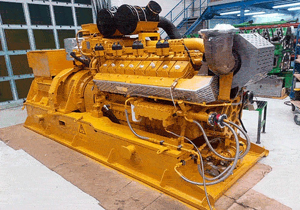 Side view of a Caterpillar CG132 gas engine with the cylinder heads fitted