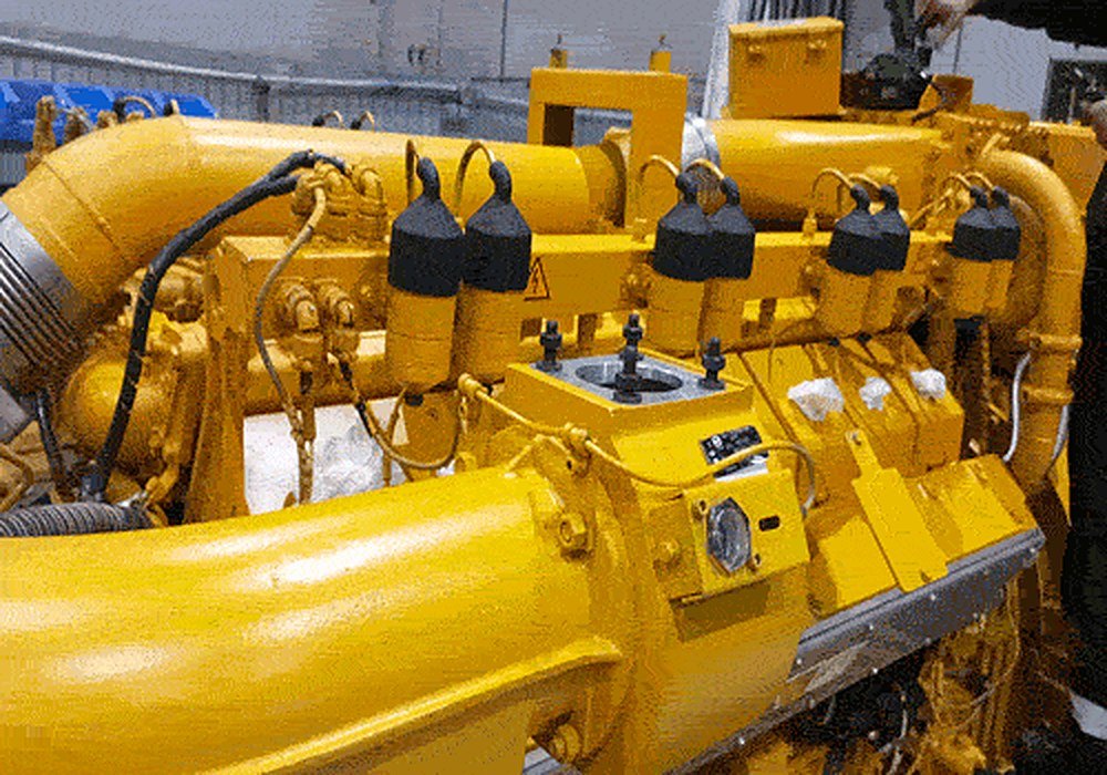 Close-up of cylinder heads and manifold of a CAT CG132 engine